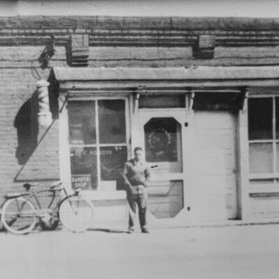 Wilson Potts in front of Potts Barber Shop
